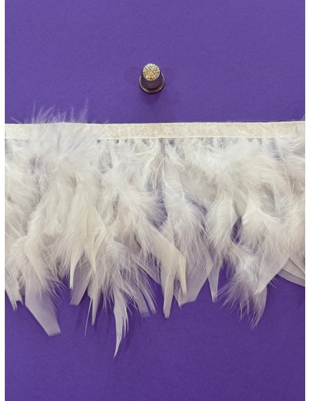 Pluma de pavo 12cm de ancho cosidas en tira