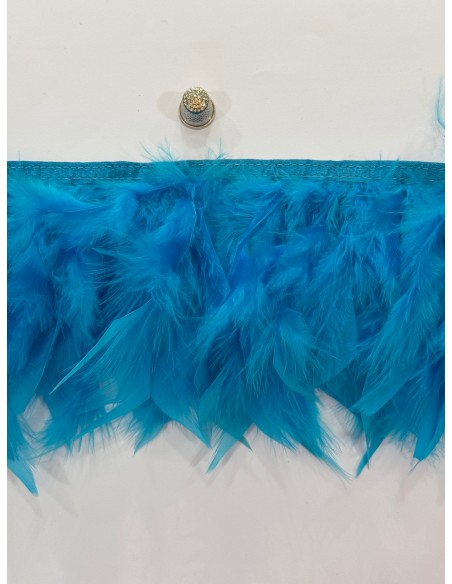 Pluma de pavo 12cm de ancho cosidas en tira