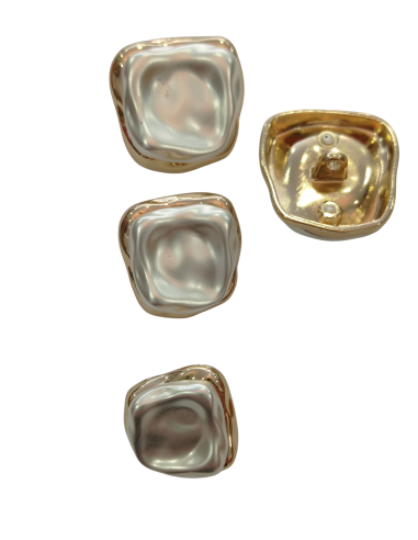 botón irregular blanco de pié metal